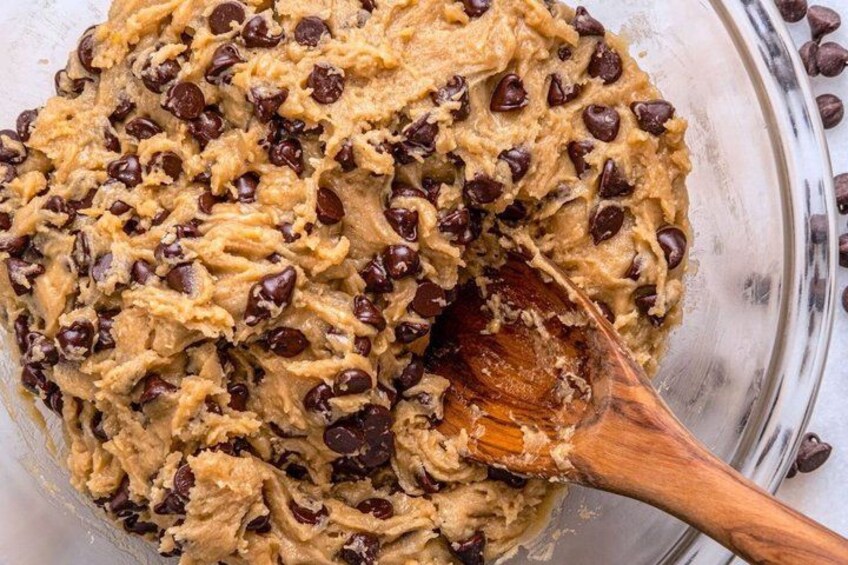 A bowl of cookie dough with chocolate chips. 3