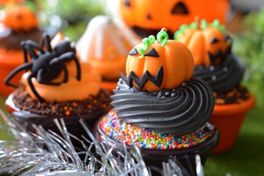 Cupcakes with Halloween-themed decorations. 3
