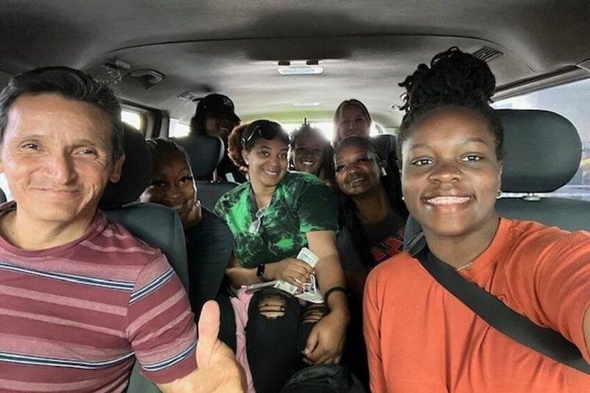 A group of people inside a vehicle. 4