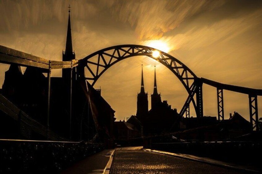 A bridge with a sunset in the background. 4