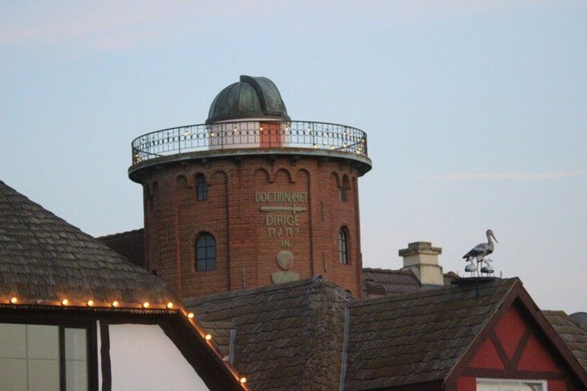 A brick tower with a dome and a sign that reads 'Director's Office.' 5