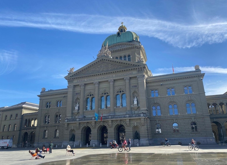 A large historic building with a prominent dome and classical architecture. 2