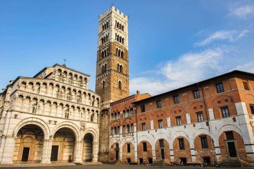 A historic building with a tall tower and arched windows. 3
