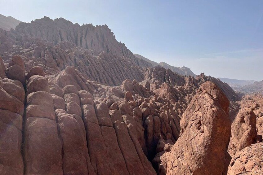 A rugged, rocky landscape with prominent geological formations. 1