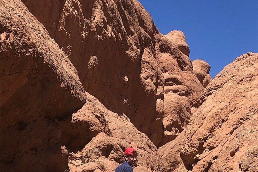 A rocky canyon with a clear blue sky. 3