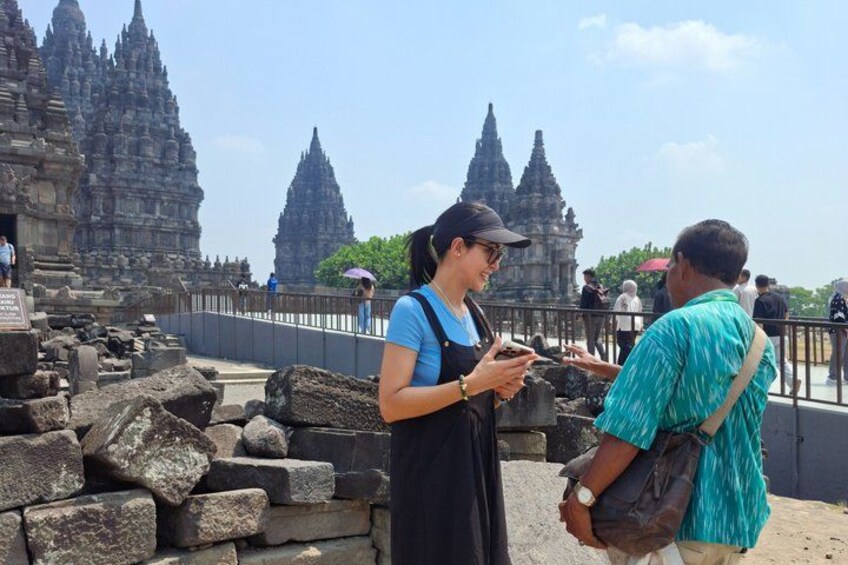 Tourists at a historical site with ancient stone structures. 4