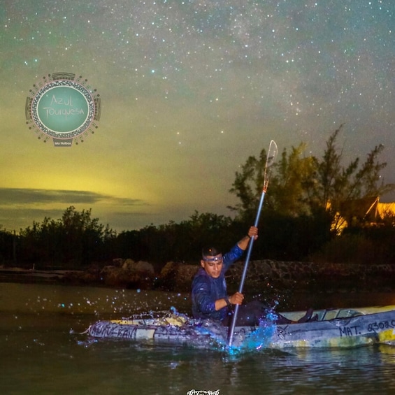 A person kayaking under a starry sky. 3