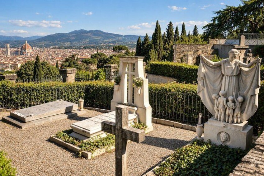 A cemetery with gravestones, a statue, and a cityscape in the background. 4