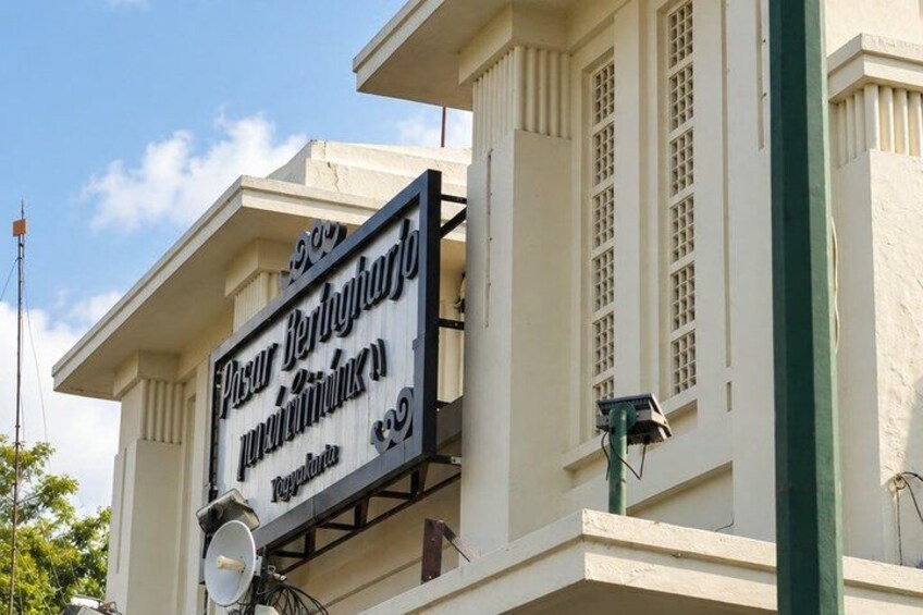 A building with a sign that reads 'Pasur Berhadiroro' and 'Pangunan'. 5
