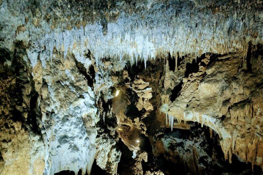 A cave with stalactites and stalagmites. 3
