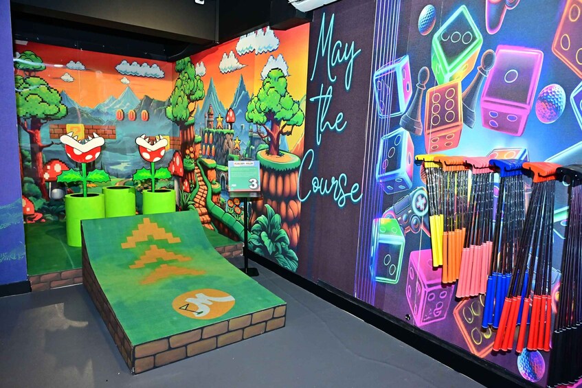 A colorful room with pixel art, neon signs, and various gaming accessories. 5