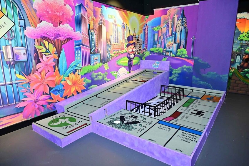 A Monopoly board game set against a colorful cityscape backdrop. 2