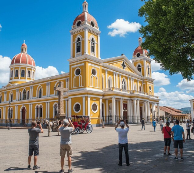A historic yellow building with domes and columns, surrounded by people taking photos. 5