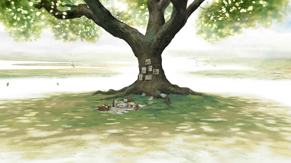 Ett stort träd med en picknickplats inrättad vid dess rötter. 2
