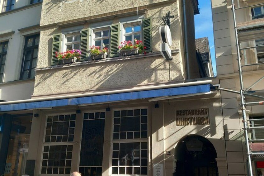 A building with a sign that reads 'RESTAURANT UHTURM.' 3