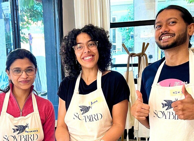 Three people wearing aprons with the logo 'SOVBIRD' and the name 'Anna' on one of them. 4