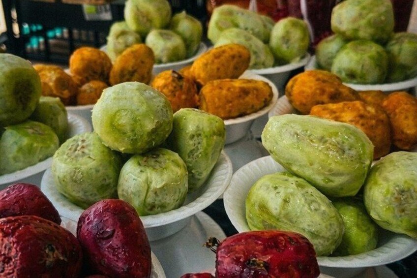 Various fruits and vegetables displayed on plates. 4