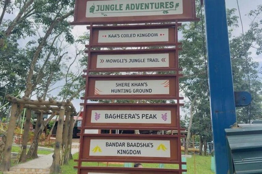 A signpost with multiple directional signs for various attractions. 3
