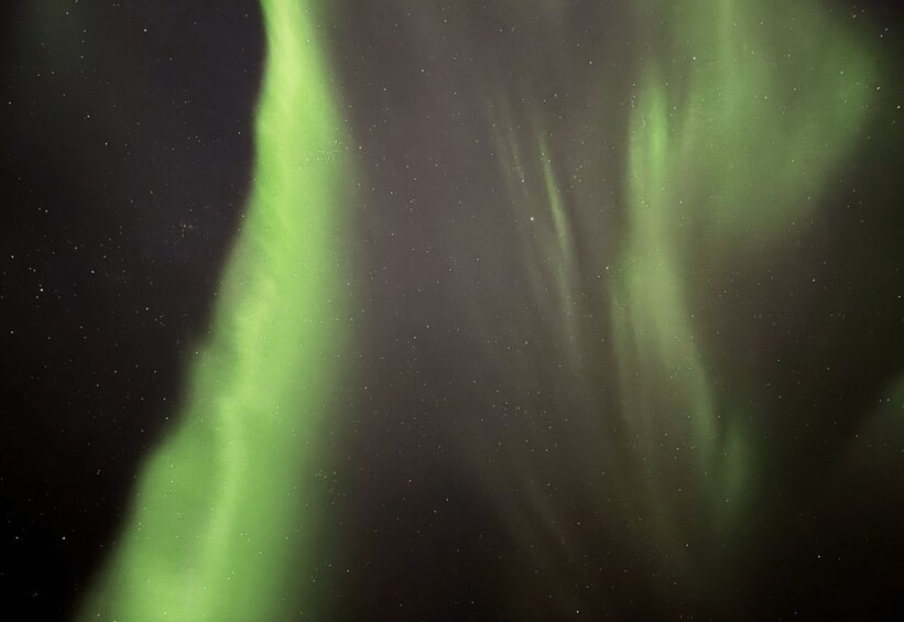 The Northern Lights (Aurora Borealis) in the night sky. 4