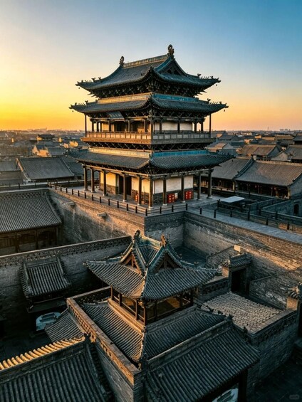 A traditional Chinese pagoda with multiple tiers, surrounded by other historical buildings. 5