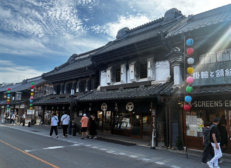 Traditional Japanese architecture with tiled roofs and wooden structures. 1