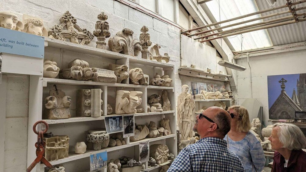 A museum with stone sculptures on display. 1