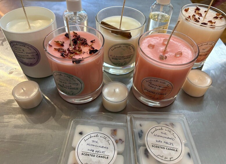 A variety of scented candles and wax melts on a table. 4
