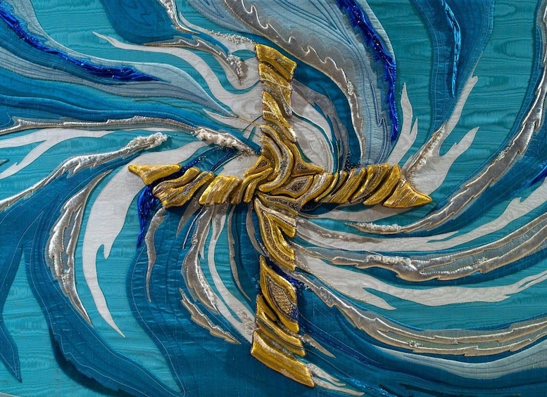 A close-up of a fabric with a golden cross design. 1