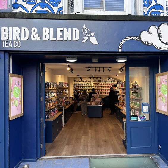 The storefront of Bird & Blend Tea Co. with a blue exterior and a signboard. 3