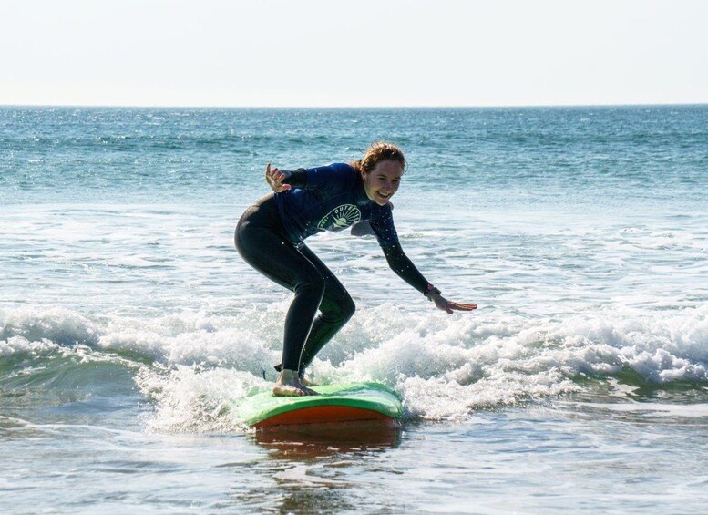 A person surfing on a wave in the ocean. 2