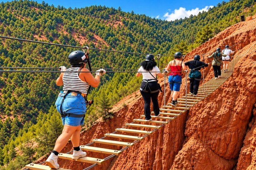 People walking on a wooden staircase in a mountainous area with trees. 2