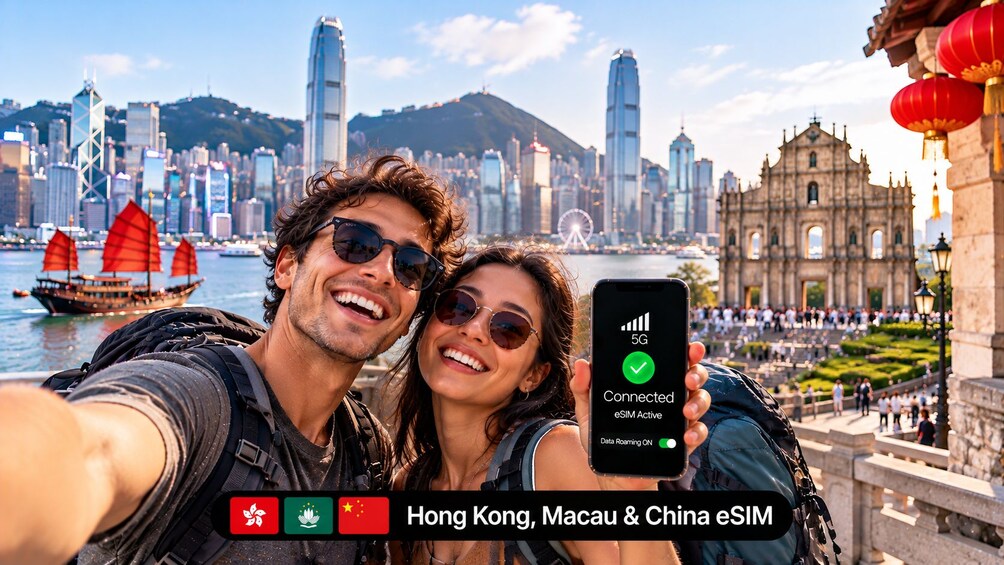 A couple taking a selfie with a smartphone displaying a 5G connection in Hong Kong. 2