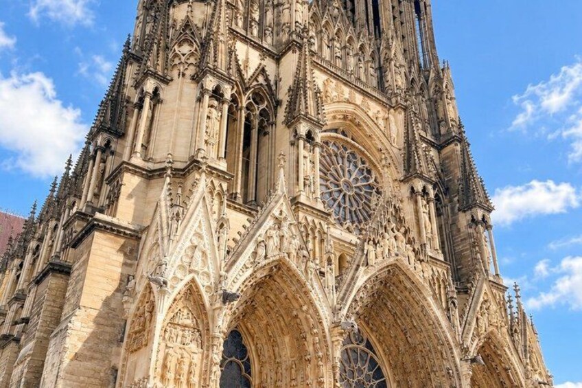 A Gothic cathedral with intricate stonework, large rose window, and pointed arches. 3