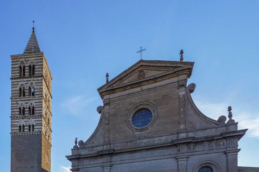 A church with a bell tower and a dome. 2
