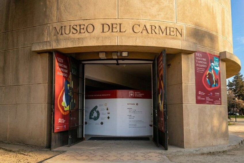 The entrance to Museo Del Carmen with a signboard and banners. 1