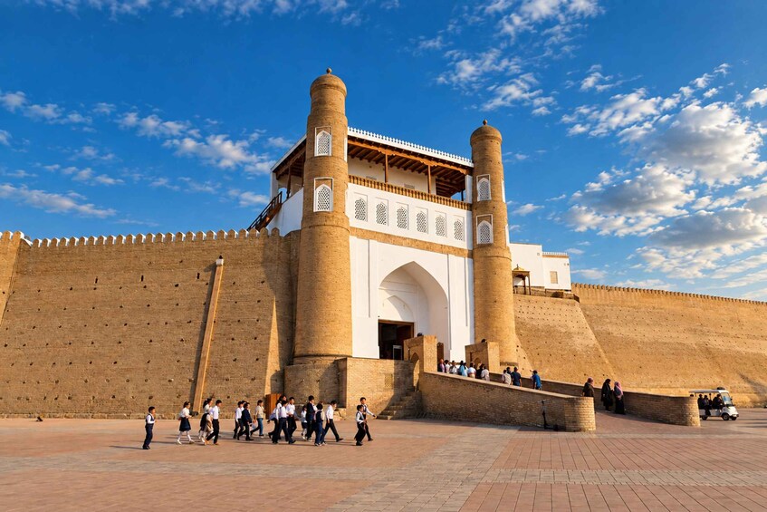 A historic fort with two prominent towers and a large arched entrance. 3