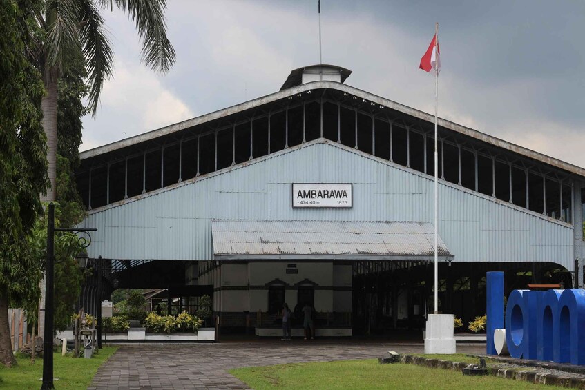 A building with a sign reading 'AMBARAWA' and a flag. 3