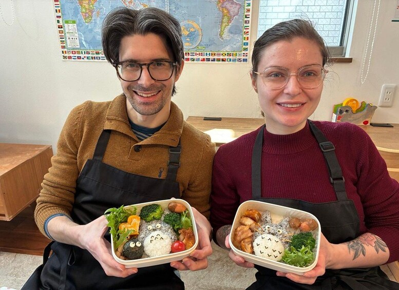Two people holding food containers with various items like rice, vegetables, and meat. 3