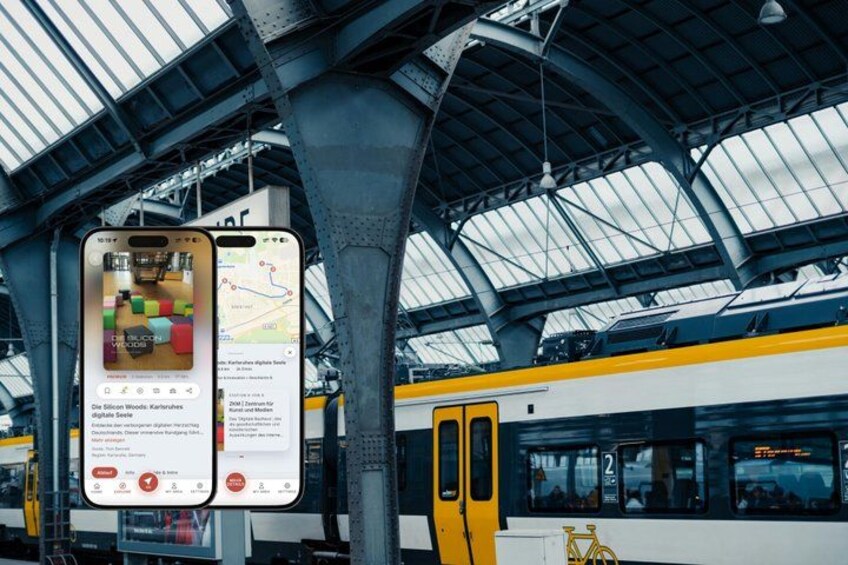 A train station with a mobile phone displaying a map and a train with the number 2 on its side. 1