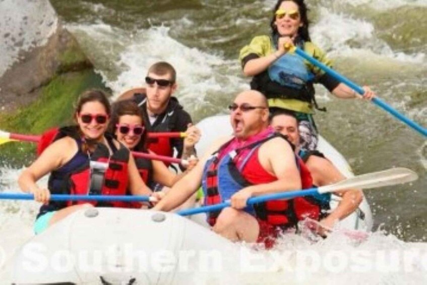 A group of people rafting on a river. 3