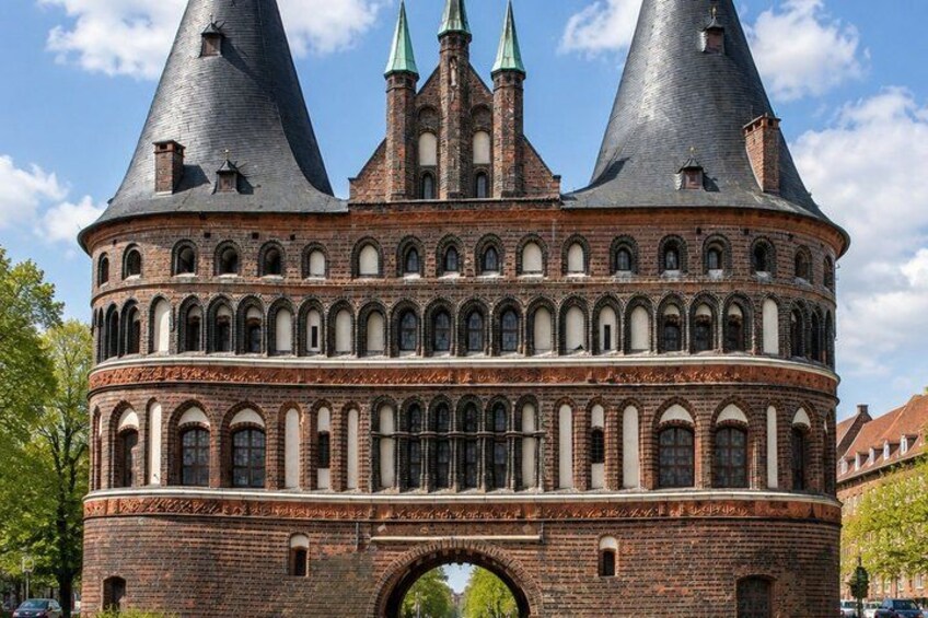 A historic building with a round tower and a brick facade. 4
