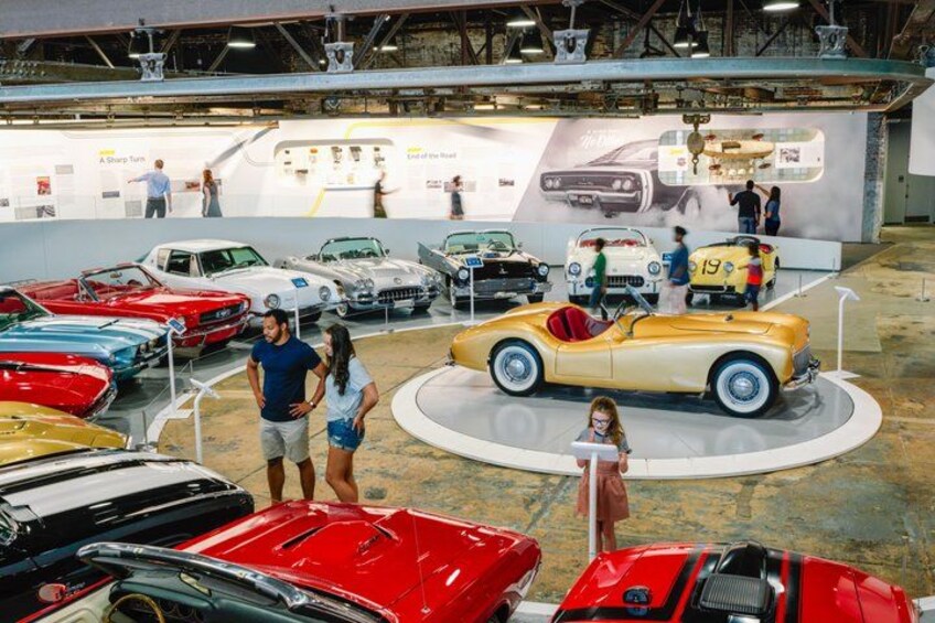 A car exhibition with vintage cars on display. 1