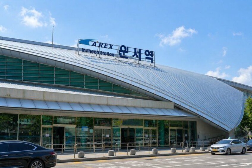 A modern building with a curved roof and large glass windows, labeled 'Carex Incheon Station.' 4