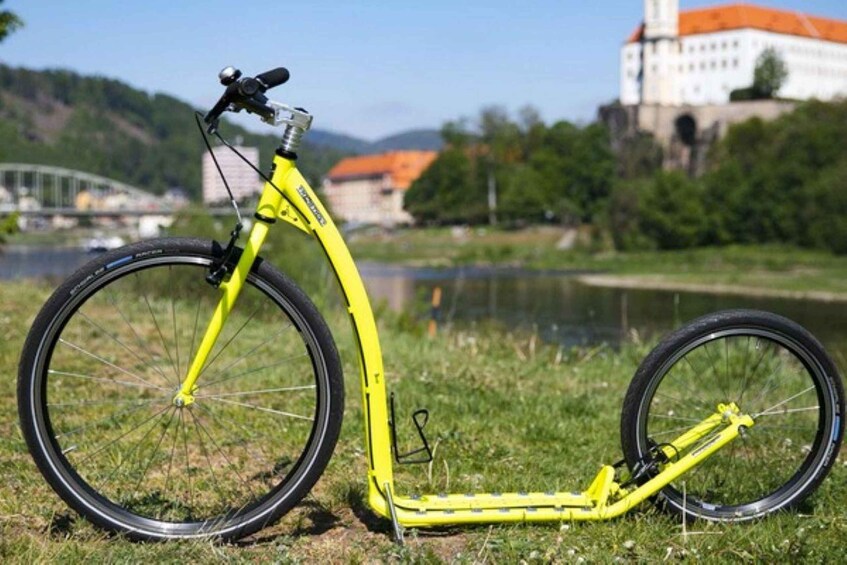 A yellow bicycle with a front suspension fork, a rear suspension fork, and a water bottle holder. 4