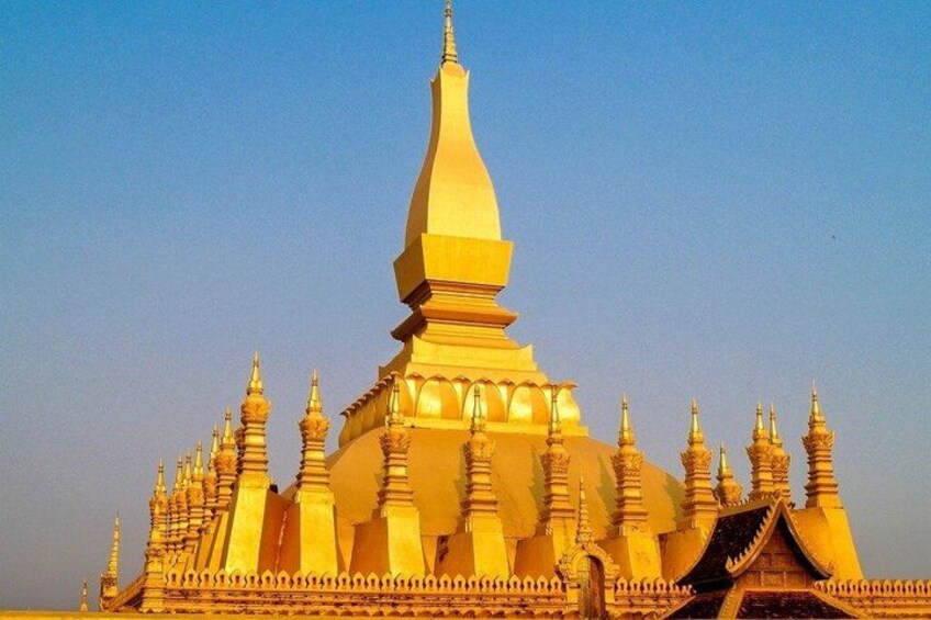 A golden temple with multiple spires and a large central spire. 4