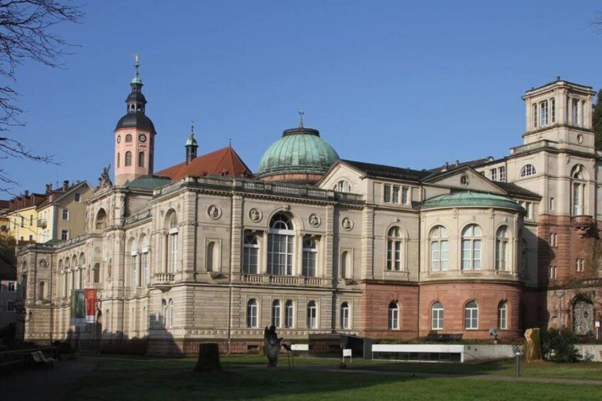 A historic building with a dome and a tower. 1
