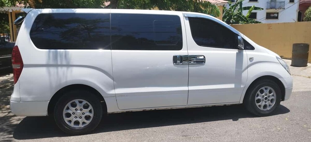 A white van parked on a street. 1