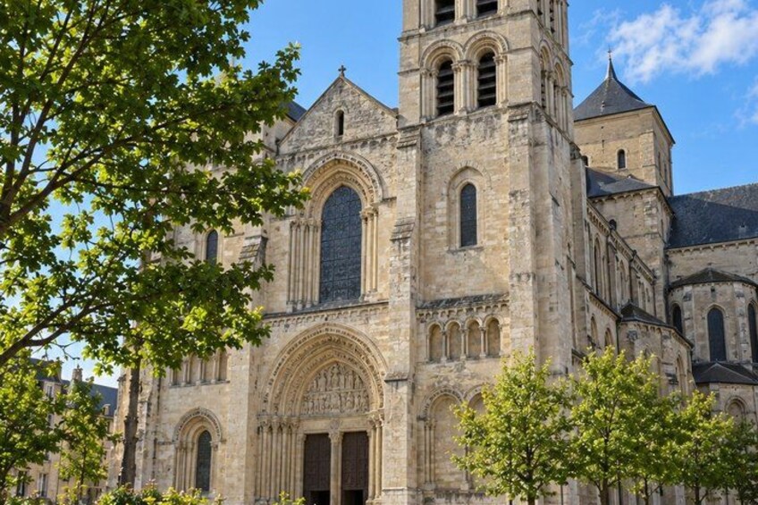 A historic stone cathedral with a prominent bell tower and arched windows. 2