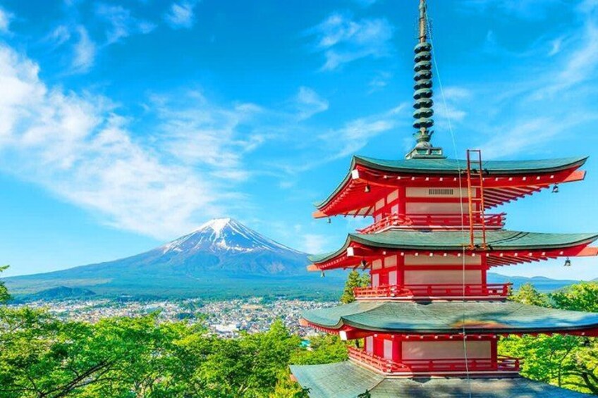 A red pagoda, Mount Fuji in the background, and a lush green landscape. 2