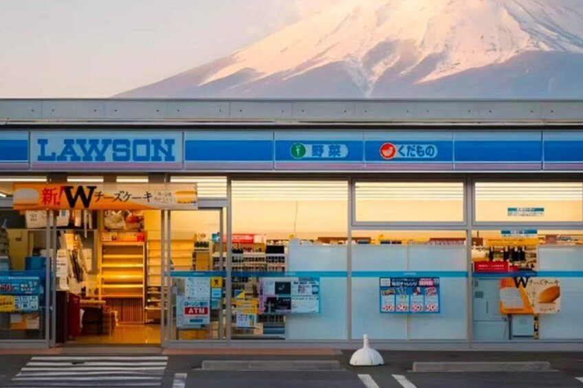 A Lawson convenience store with a mountain in the background. 4